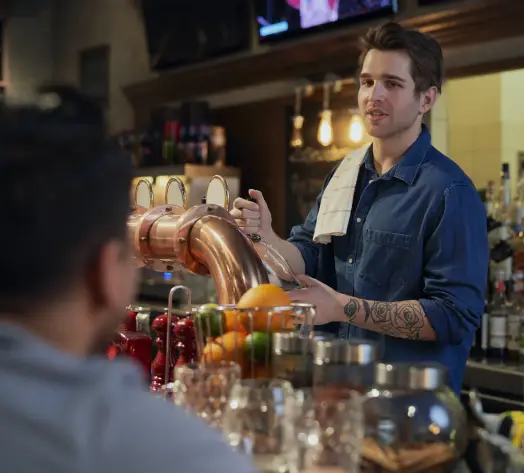 Liquor Liability Insurance for Bars Bartender pouring drinks at upscale bar