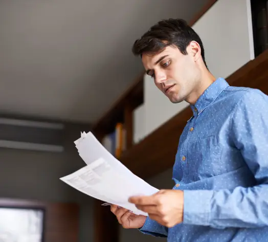 Customized Insurance for Landlords Landlord reviewing apartment insurance policy