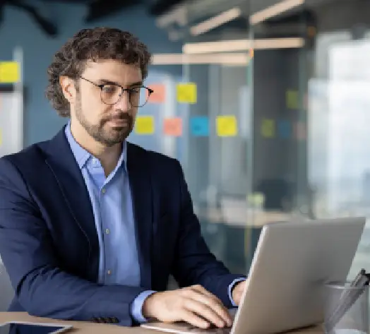 E&O Insurance for Freelancers Professional at a laptop working