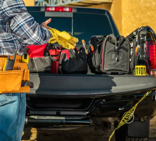 Protect Tools with Inland Marine Insurance Contractor loading tools into work truck