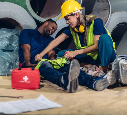 Injury Coverage and Support Construction worker receiving on-site medical assistance